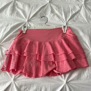 A Lucky in Love small peach tennis skirt.  12” long.  Worn once